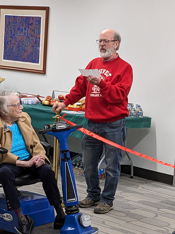 Photo of Barry LaRue leading his schoolmates in song