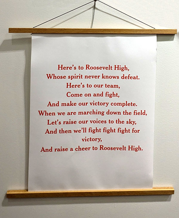 Photo of a banner displaying the words to Roosevelt High's fight song